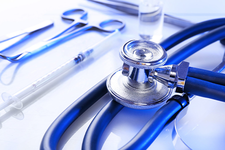 Medical devices - Stethoscope, Syringe, Vial, Tweezers Laying on Table