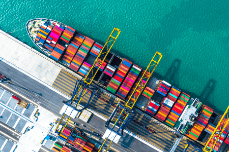 Ocean Cargo Ship Being Loaded at Modern Port