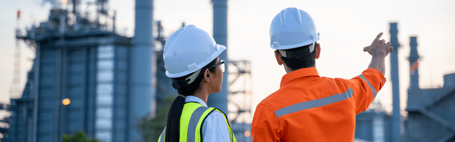 Man and Woman Worker Having Discussion Outside of Chemical Plant