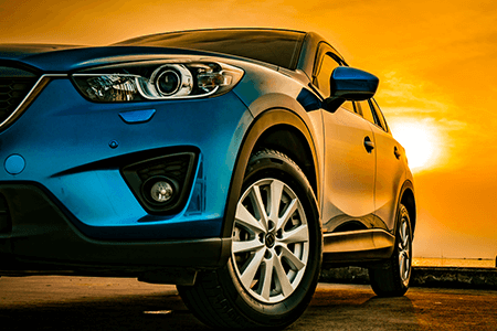 Blue Car in Sunset