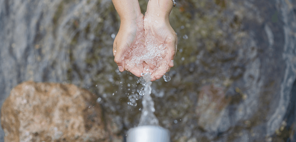 Hands Under Running Water Outdoors