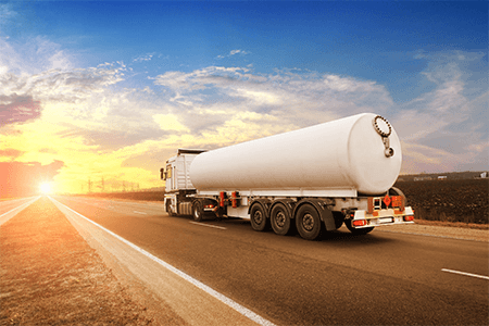 Tanker truck driving on road