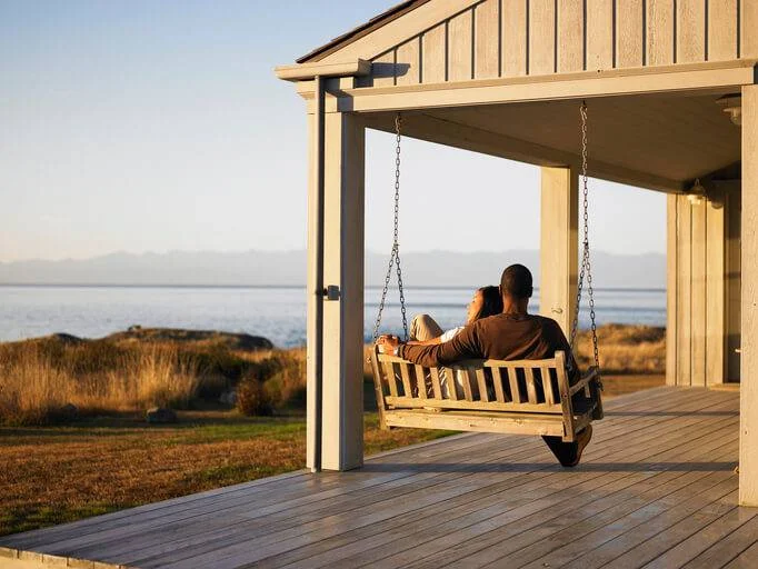 Couple relaxing at coastal home